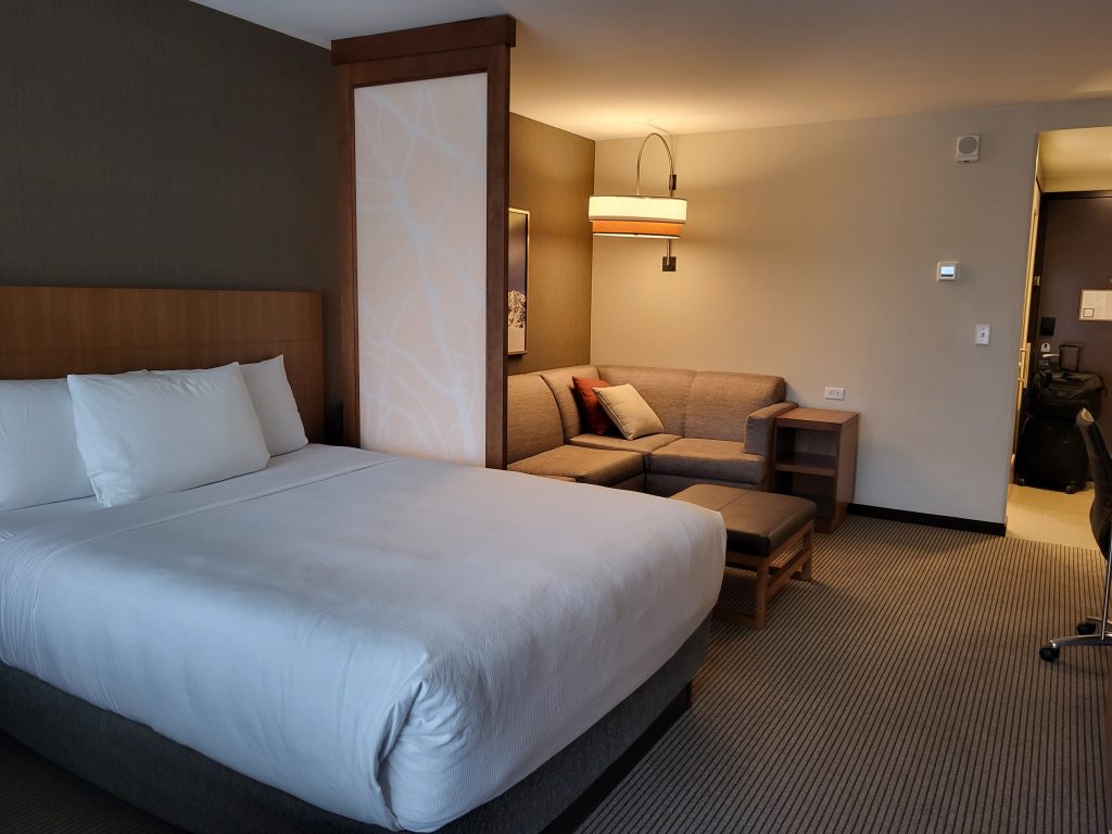 A cozy and inviting room at Hyatt Place Hotel Midtown in Anchorage, where warm hospitality awaits.