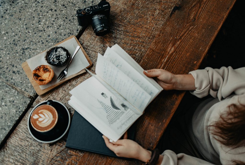 Delicious Pastel de Nata, traditional Portuguese custard tarts, displayed on a ceramic plate with a golden crust and creamy filling, symbolizing Portugal's rich culinary heritage - Solange Isaacs.