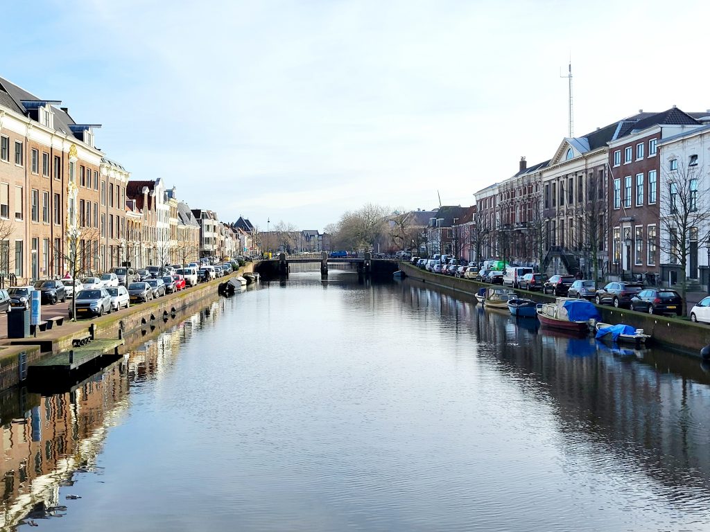 Scenic canal in Haarlem, Netherlands with traditional Dutch houses and boats | Solange Isaacs