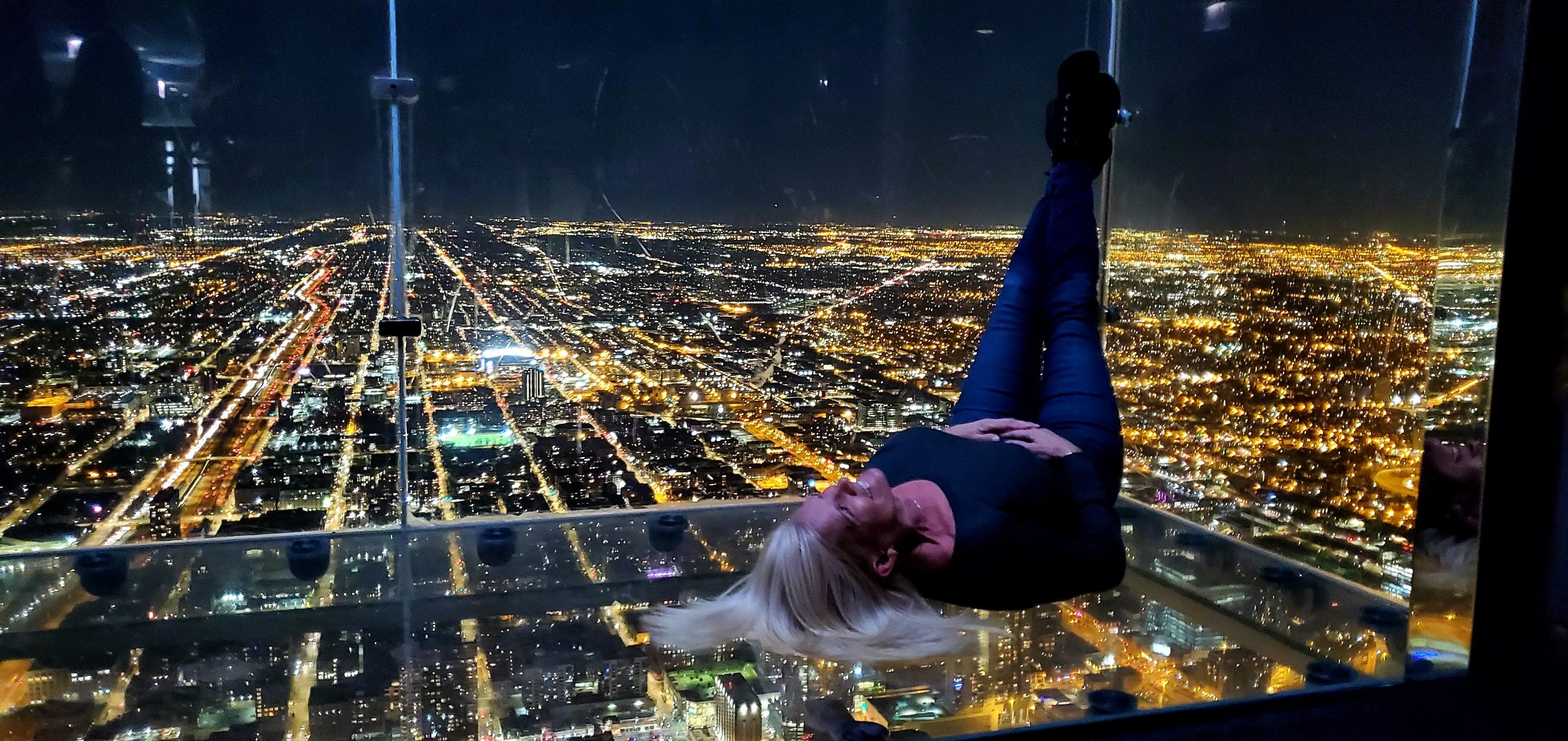 Panoramic view of Chicago's skyline from the 360 Chicago Observation Deck, showcasing the city's iconic architecture and Lake Michigan in the background.