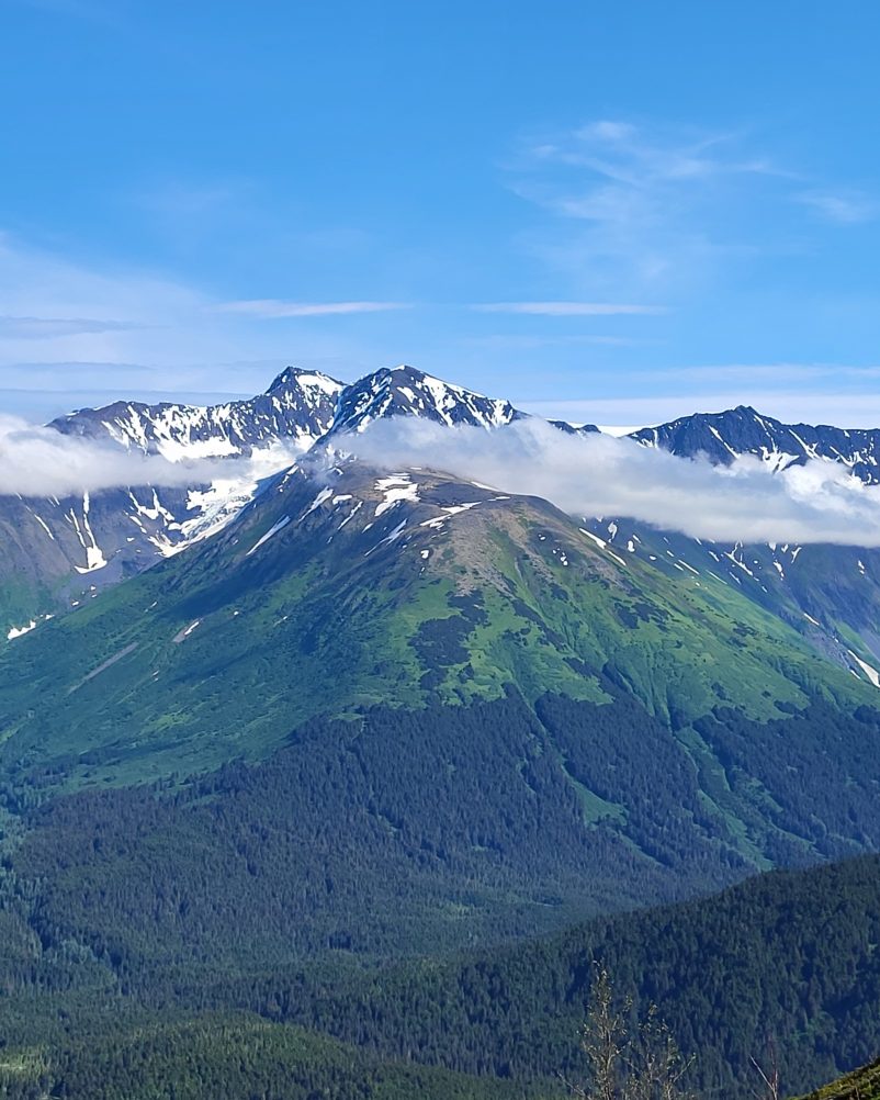 A stunning view of the majestic mountain, with snow-capped peaks and picturesque valleys, in Anchorage, Alaska.